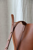 Round leather bucket bag brown