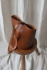Round leather bucket bag brown